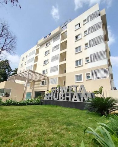 Shweta Shubham apartment block seen from the landscaped lawn